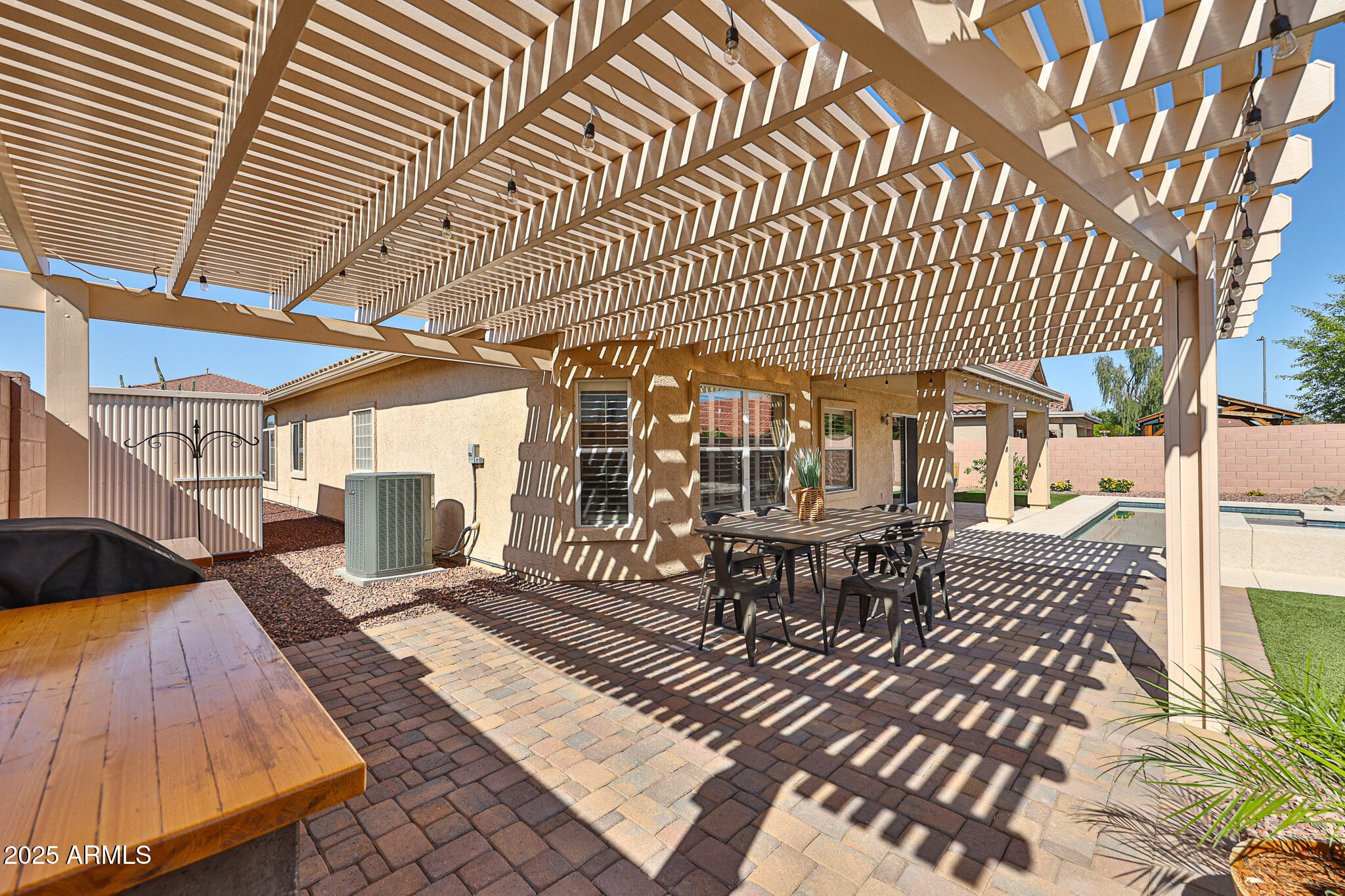 15731 West Redfield Road Surprise, AZ 85379 - Photo 42 of 48 a view of a patio with table and chairs with wooden floor and fence