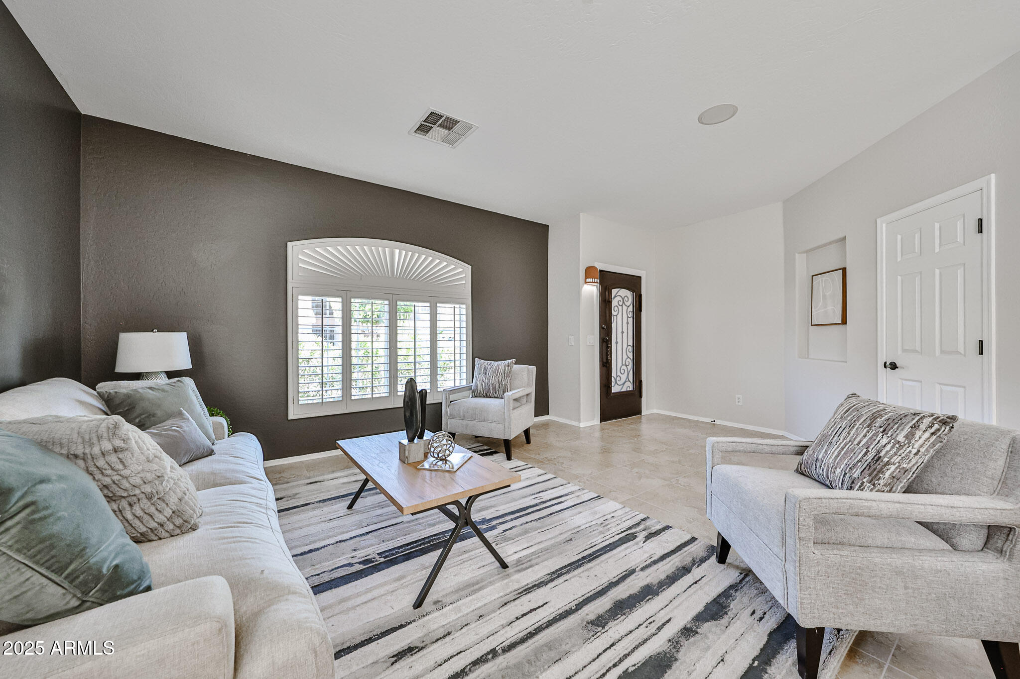15731 West Redfield Road Surprise, AZ 85379 - Photo 10 of 48 a living room with furniture and a large window