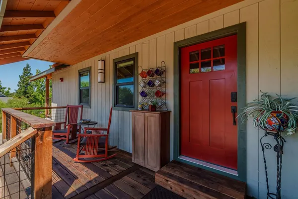 an aerial view of a house with a yard basket ball court and outdoor seating