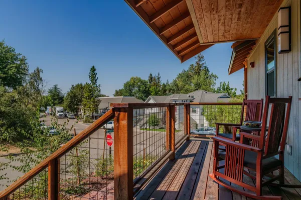 an aerial view of a house with a yard basket ball court and outdoor seating