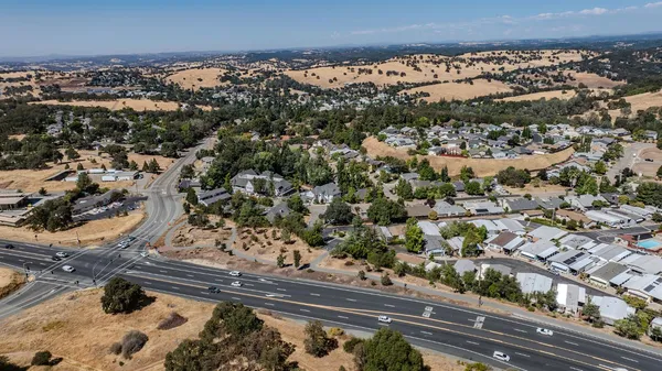 a bathroom with a granite countertop sink toilet a mirror and shower
