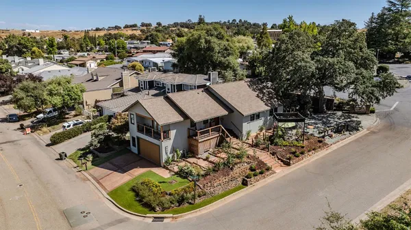 a kitchen with stainless steel appliances wooden cabinets and a stove top oven