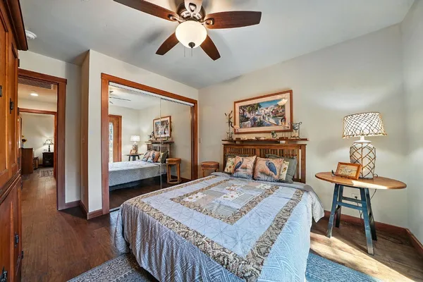 a view of balcony with chairs and potted plants