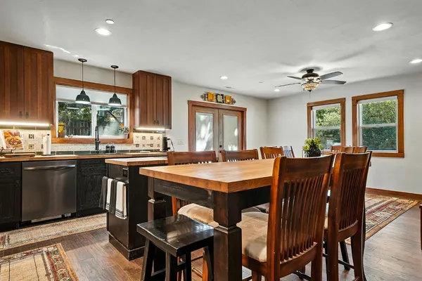 an aerial view of a house with a yard and lake view