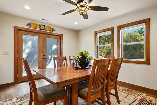 a dining room with furniture and window