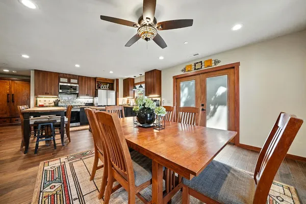 a kitchen with stainless steel appliances kitchen island granite countertop a sink and cabinets