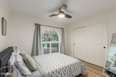 a bedroom with a bed and a window