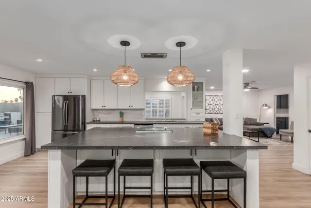 a kitchen with a table and chairs in it