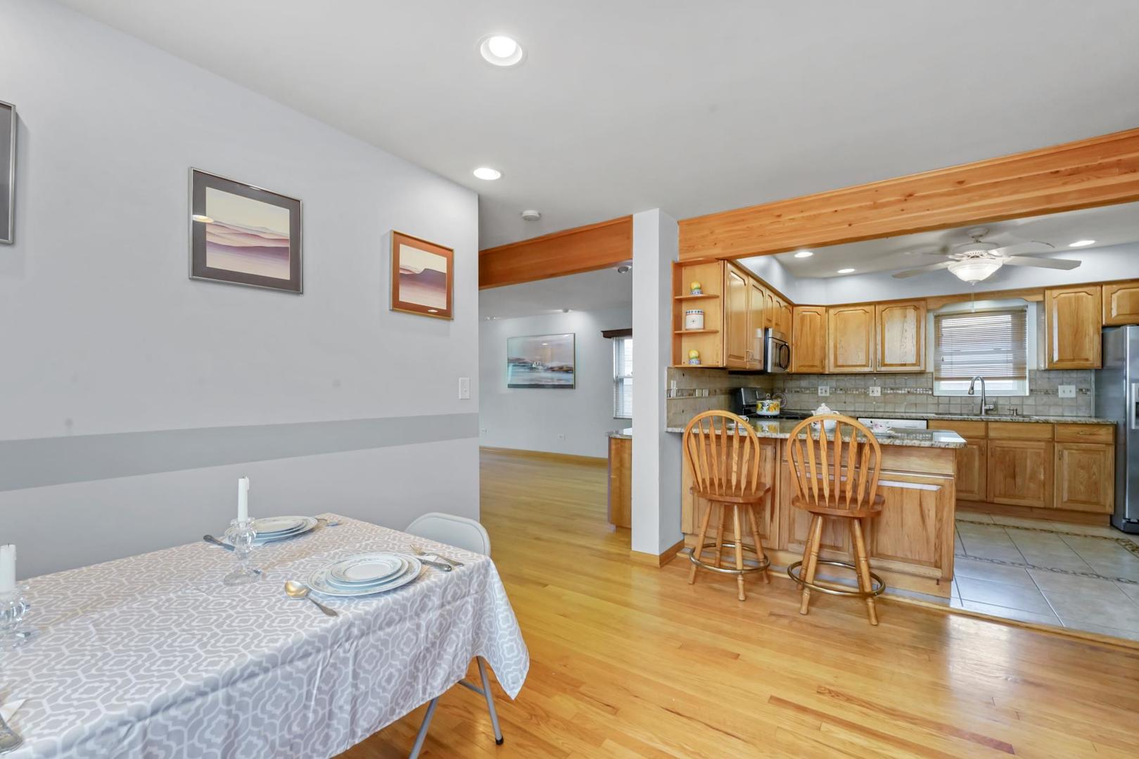 5751 South Monitor Avenue Chicago, IL 60638 - Photo 11 of 30 a living room with furniture and kitchen view