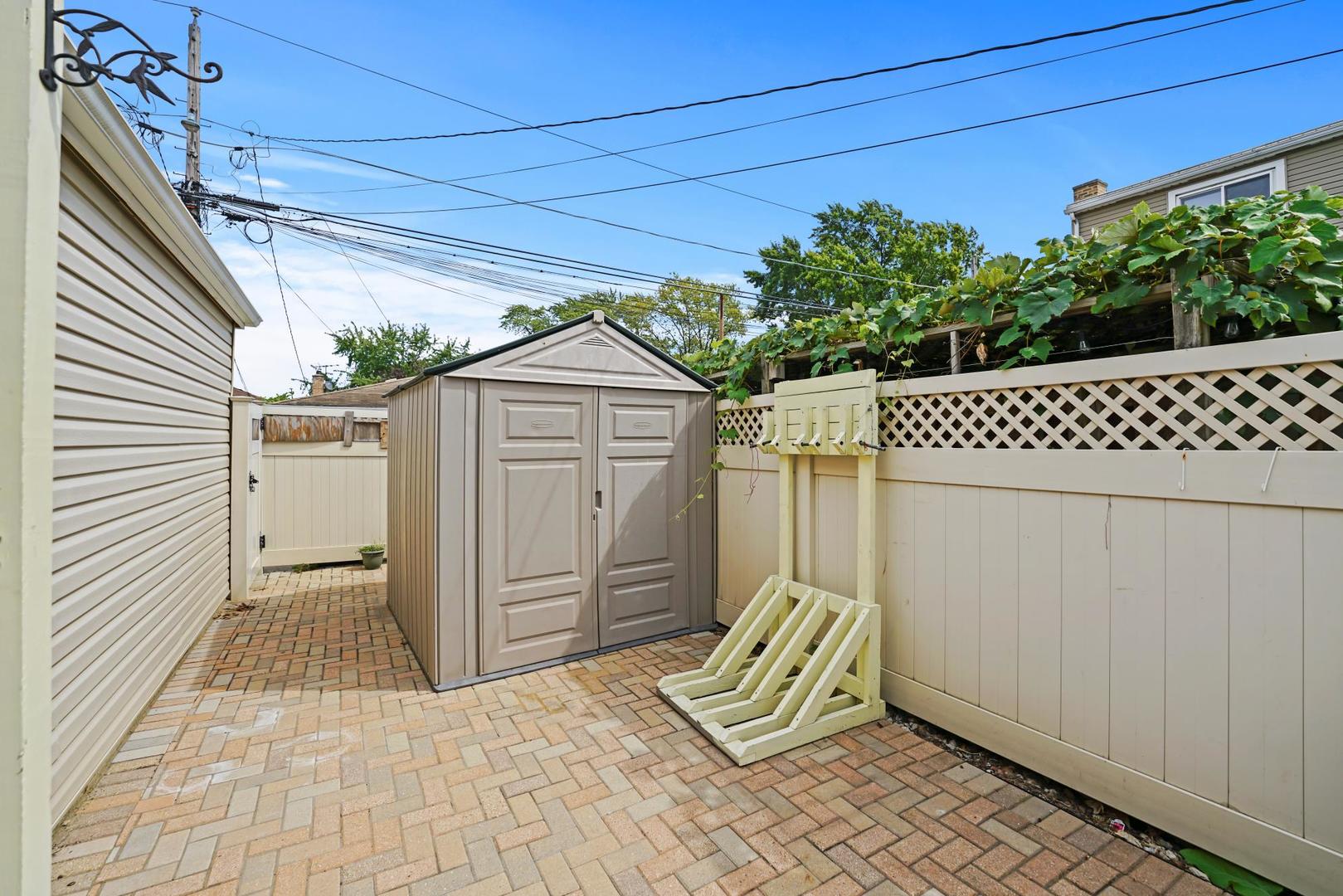 5751 South Monitor Avenue Chicago, IL 60638 - Photo 30 of 30 a house view with a backyard space