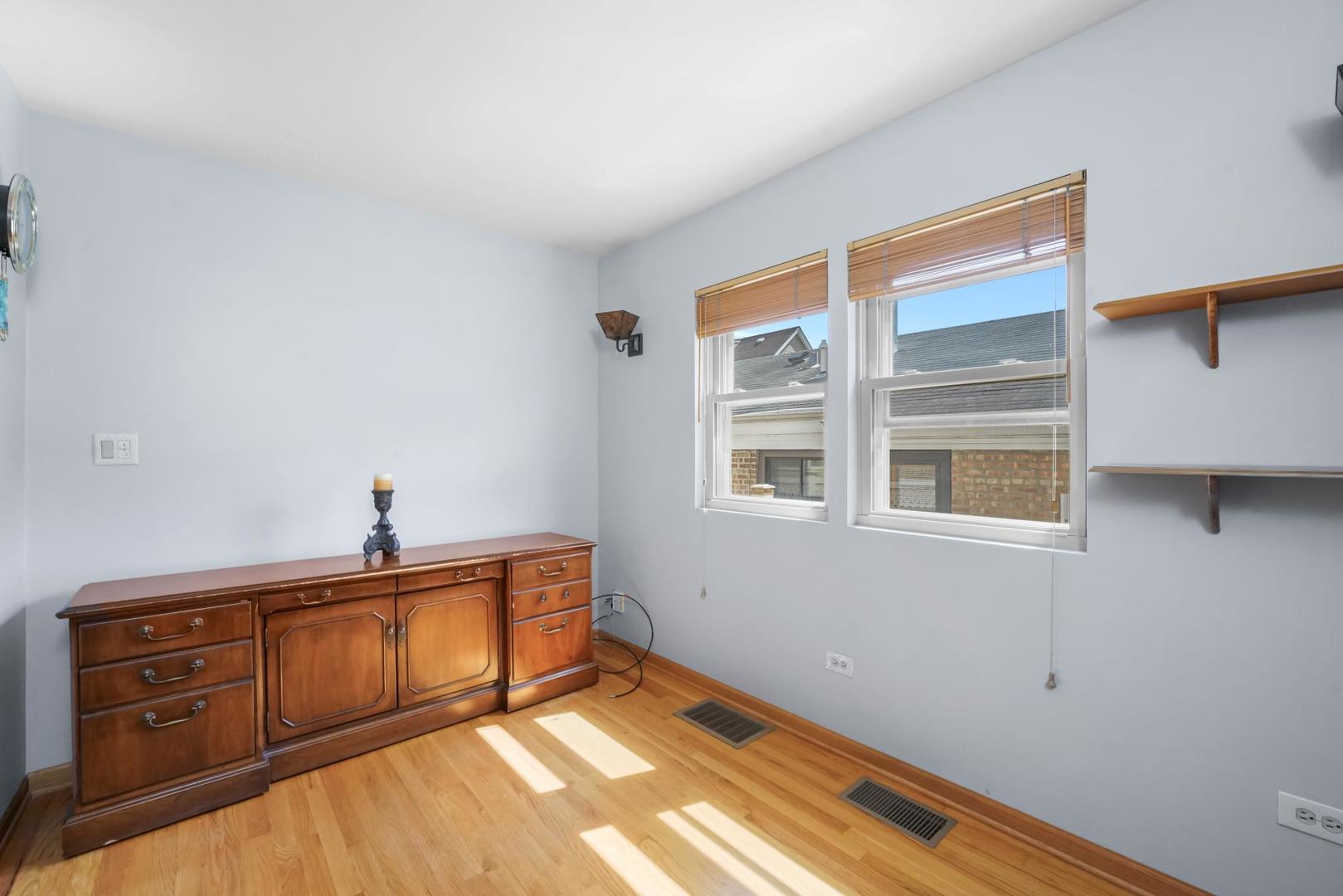 5751 South Monitor Avenue Chicago, IL 60638 - Photo 6 of 30 a view of an empty room with a window