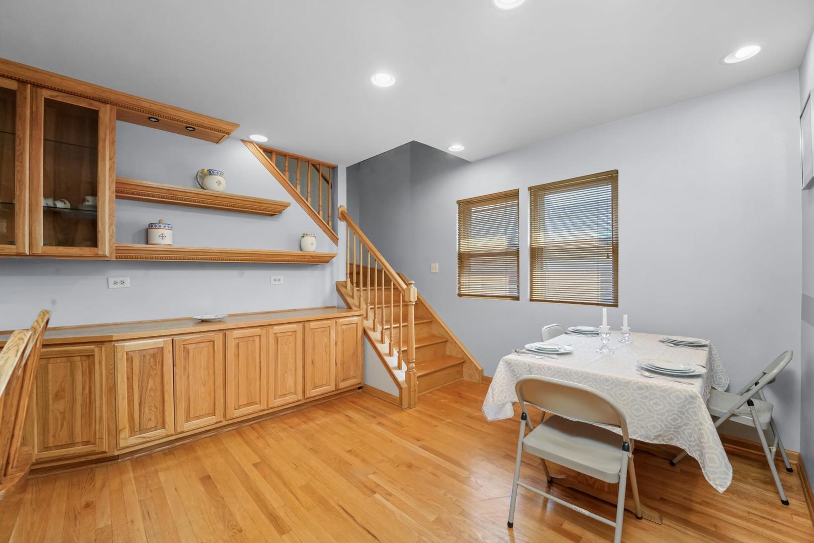 5751 South Monitor Avenue Chicago, IL 60638 - Photo 8 of 30 a view of a workspace with furniture and stairs