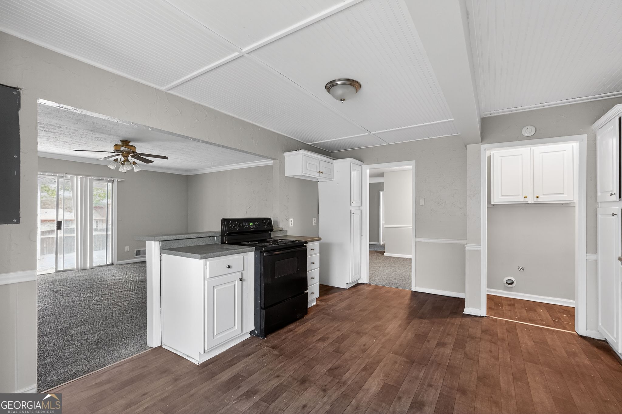 3285 Old Salem Road Southeast Conyers, GA 30013 - Photo 21 of 33 a kitchen with granite countertop a stove and a refrigerator