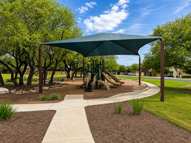 1928 Lakeside Ranch Road Georgetown, TX 78633 - Photo 36 of 37 A well-shaded playground area offers ample space for recreation and enjoyment.