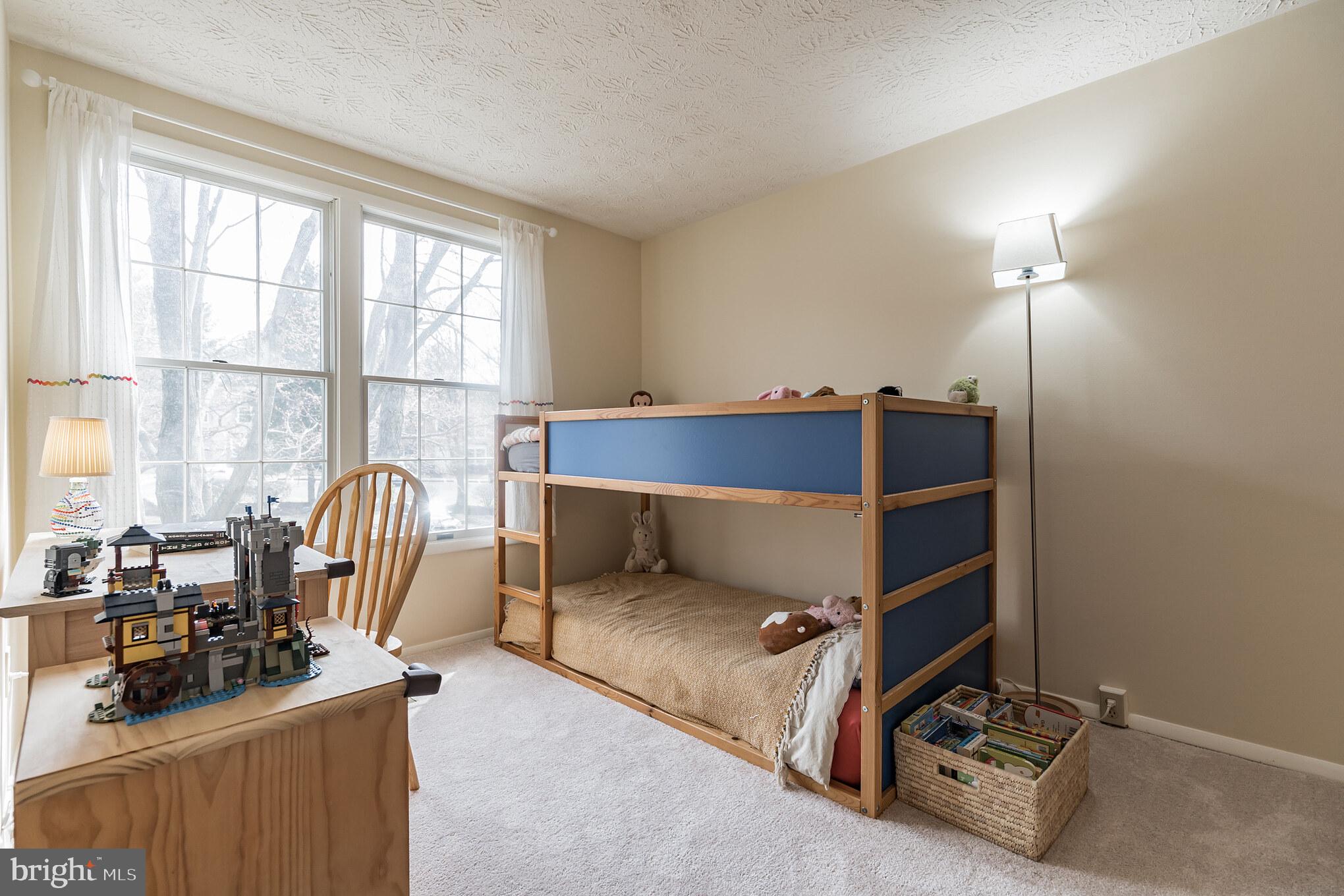 1610 Barnstead Drive Reston, VA 20194 - Photo 18 of 33 a bed room with a bed and a chair
