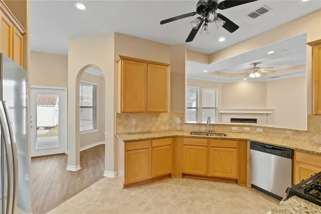 a kitchen with a sink cabinets and window