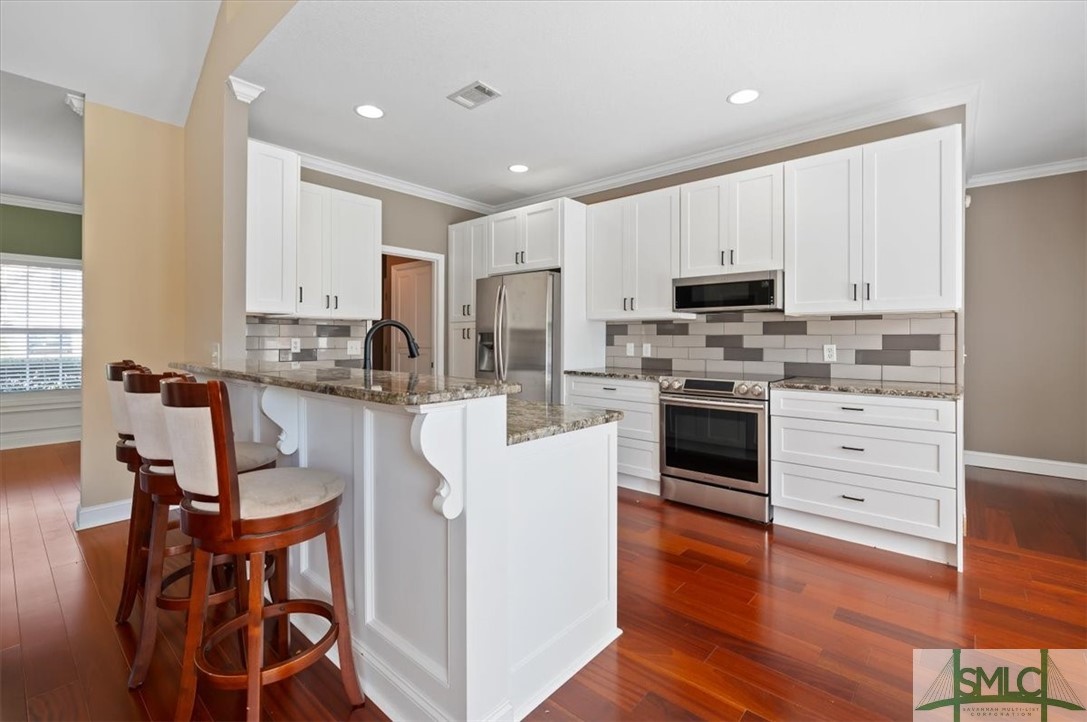 111 Tolliver Lane Rincon, GA 31326 - Photo 13 of 39 Recessed cans in the kitchen as well as goose neck