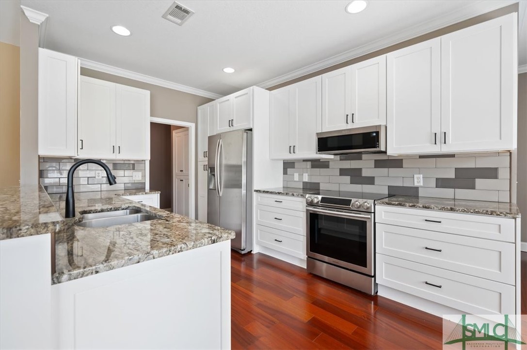 111 Tolliver Lane Rincon, GA 31326 - Photo 16 of 39 Renovated kitchen with custom pull out shelves and