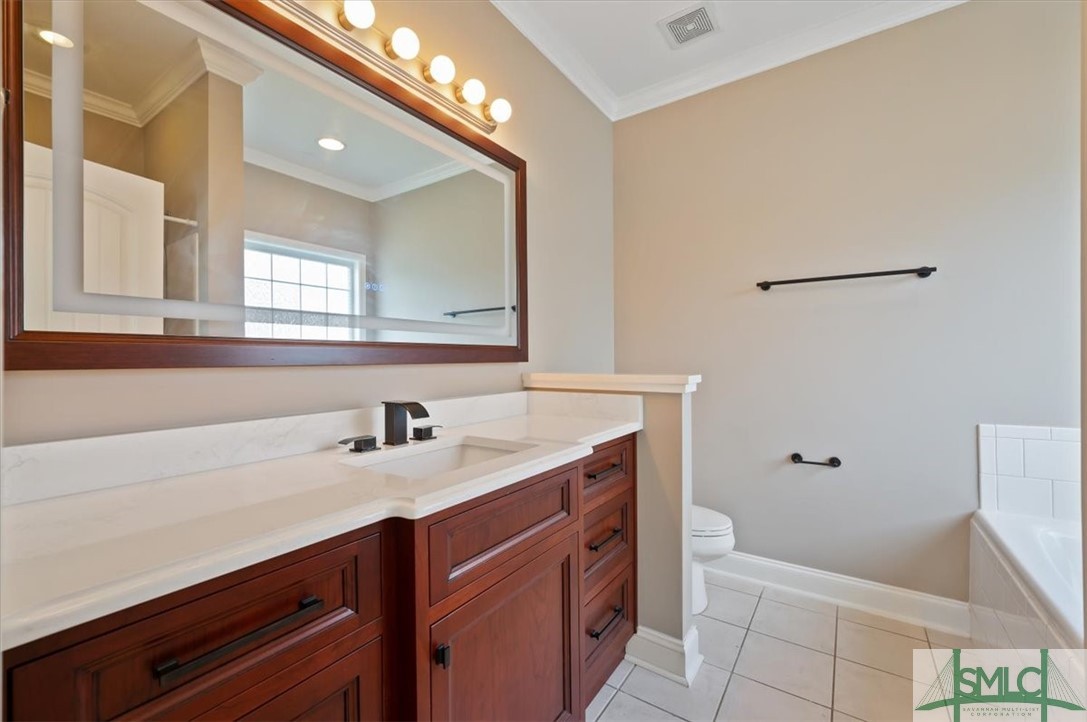 111 Tolliver Lane Rincon, GA 31326 - Photo 22 of 39 Master bath with real wood cherrry cabinetry (cust