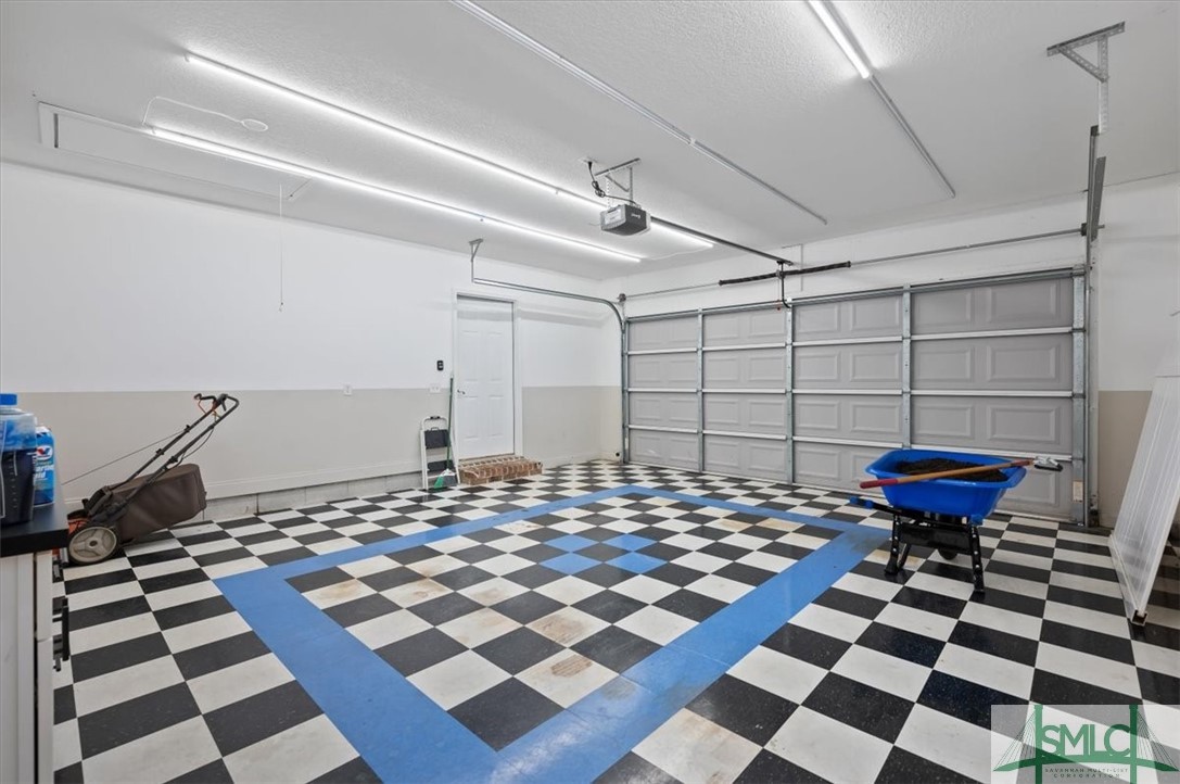 111 Tolliver Lane Rincon, GA 31326 - Photo 32 of 39 Upgraded garage flooring with lots of extra shop l