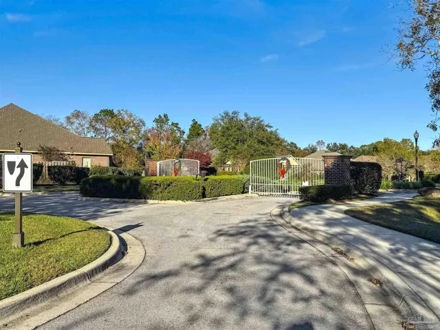 a view of a house with swimming pool and sitting area