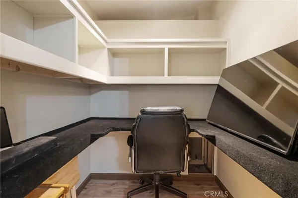 a view of a livingroom with furniture and windows