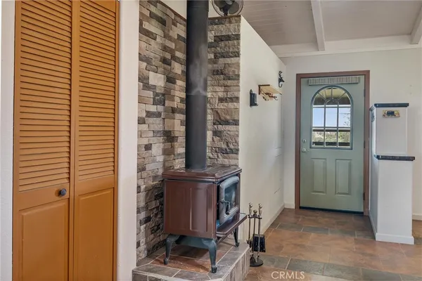a view of a dining room with furniture and a chandelier