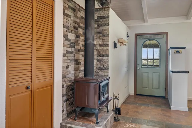 a view of a dining room with furniture and a chandelier