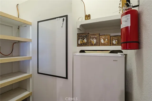 a bathroom with a granite countertop sink toilet and mirror