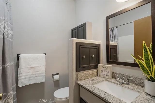 a bathroom with a toilet and a sink