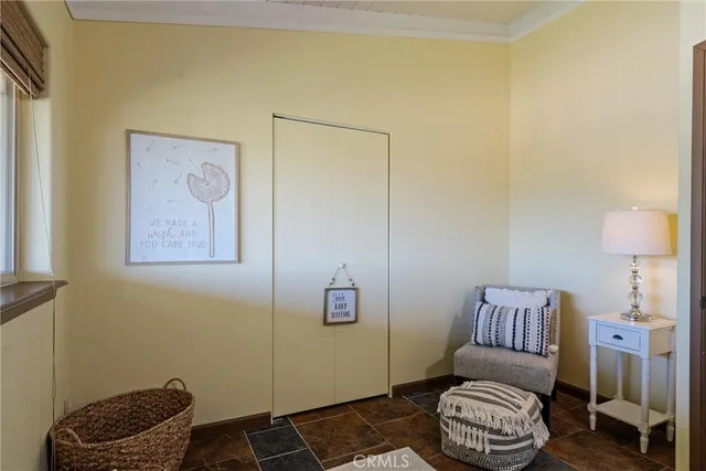 a bed room with a bed and a chair