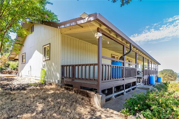 a view of a house with wooden fence