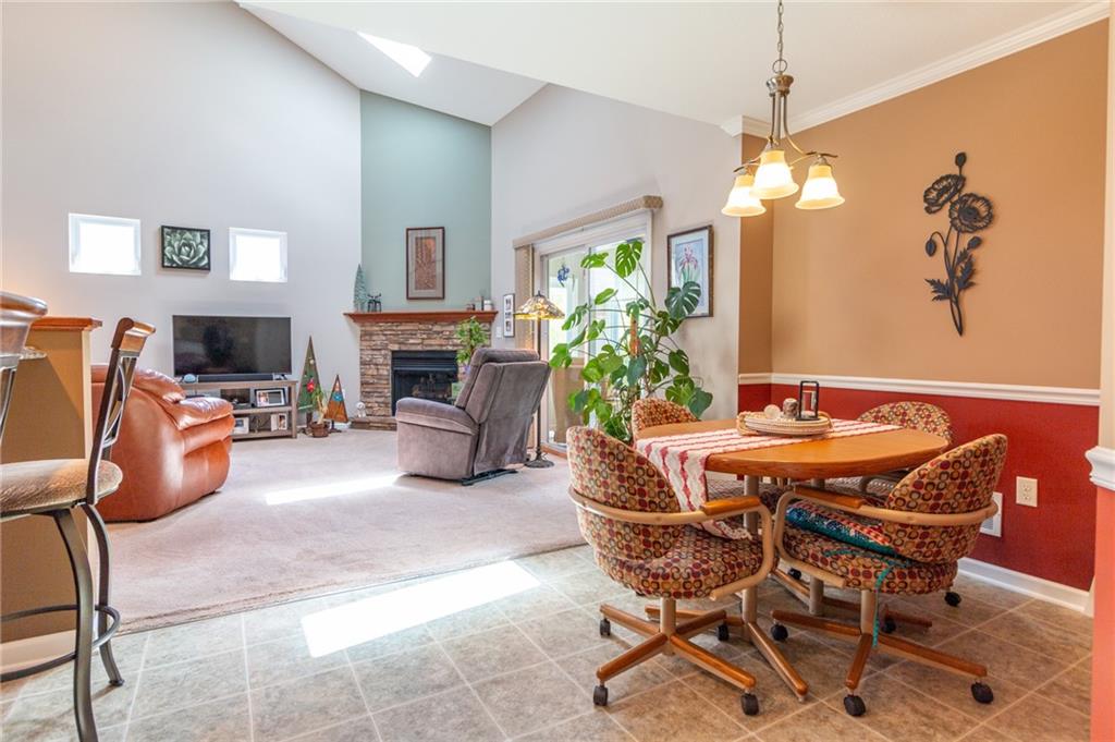 425 Chestnut Lane Apollo, PA 15613 - Photo 15 of 48 a living room with furniture a fireplace and a chandelier