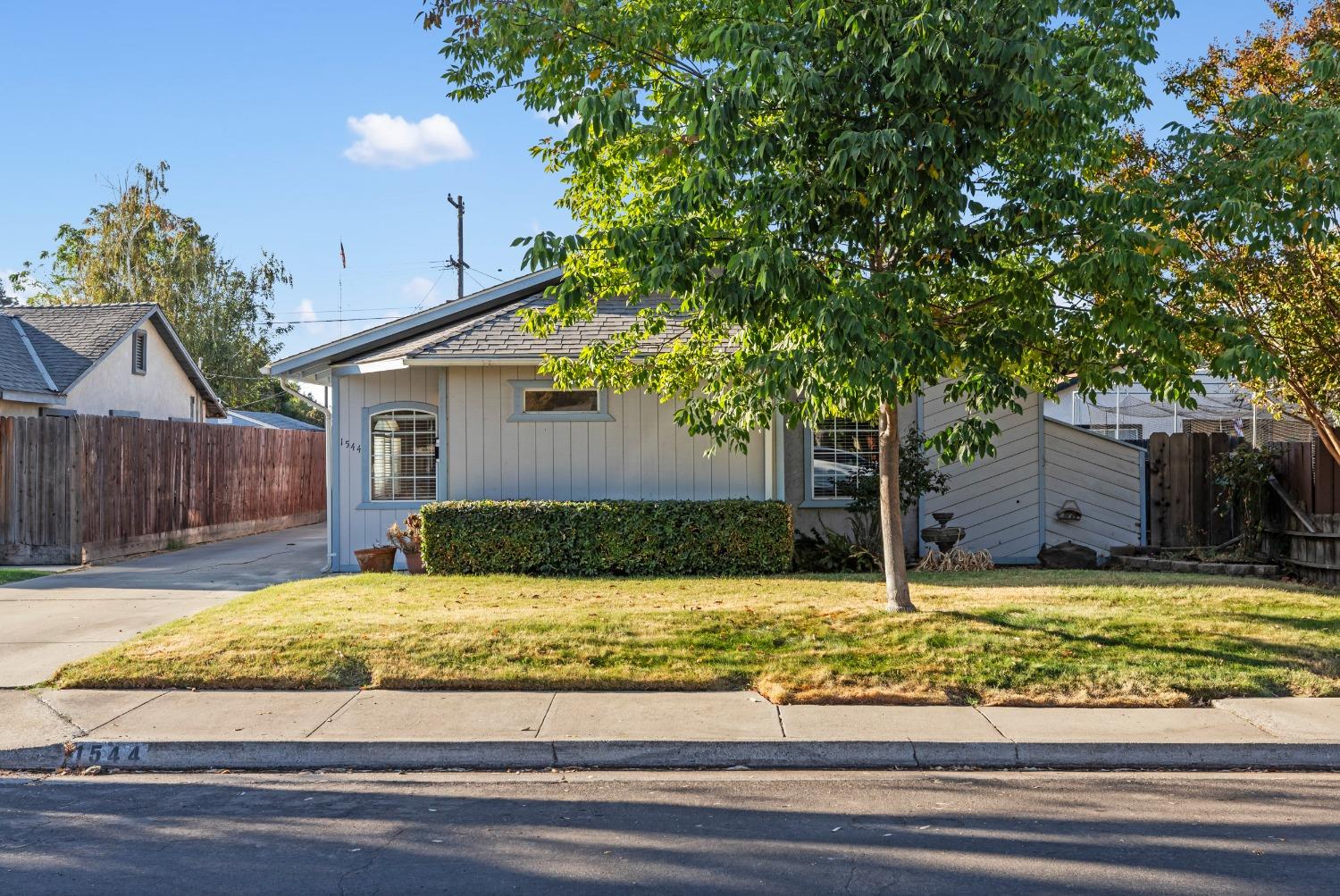 1544 Pearl Street Modesto, CA 95350 - Photo 1 of 1 a view of a house with a yard