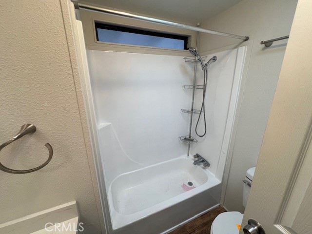 33056 Garner Road Lake Elsinore, CA 92530 - Photo 18 of 50 a bathroom with a bath tub with a shower