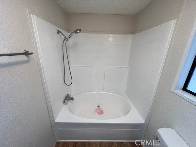 33056 Garner Road Lake Elsinore, CA 92530 - Photo 25 of 50 a white bath tub sitting next to a white sink and a shower