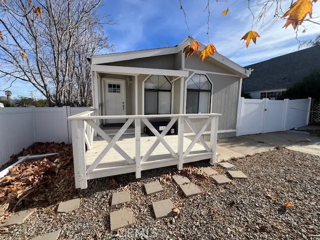 a front view of a house with sitting area