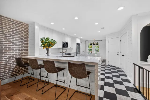 a kitchen with a dining table and chairs