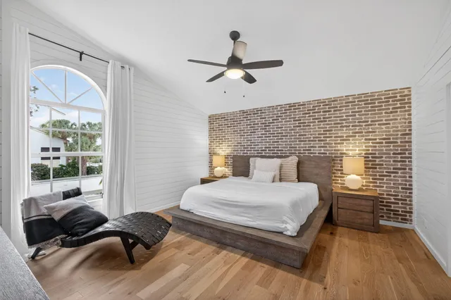 a bedroom with a bed and a couch