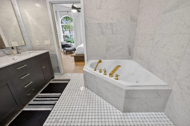 a bathroom with a bathtub and a sink