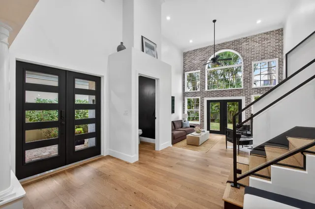 a lobby with furniture and wooden floor