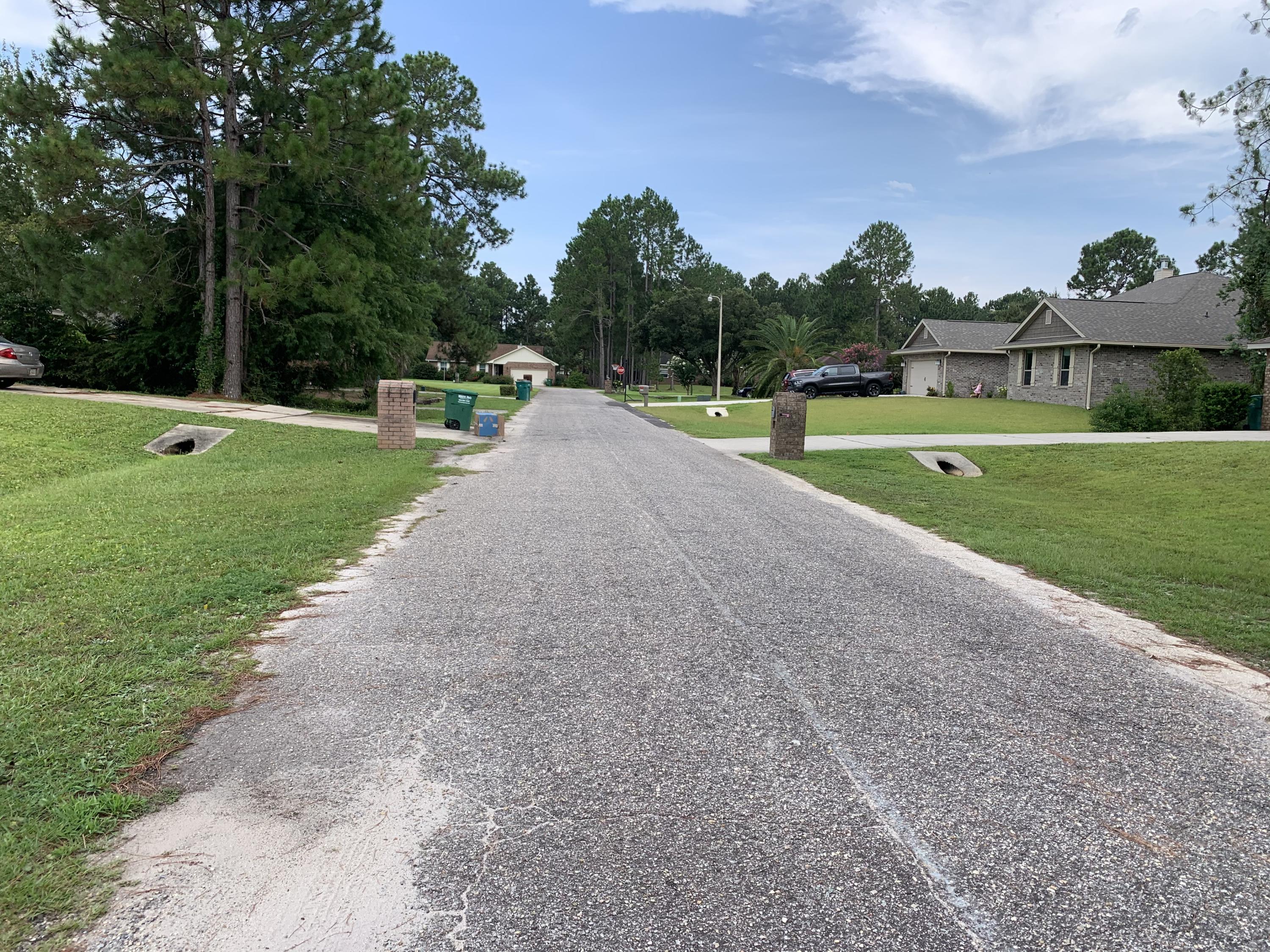 2363 Knotty Pine Drive Navarre, FL 32566 - Photo 12 of 33 a view of a park with large trees
