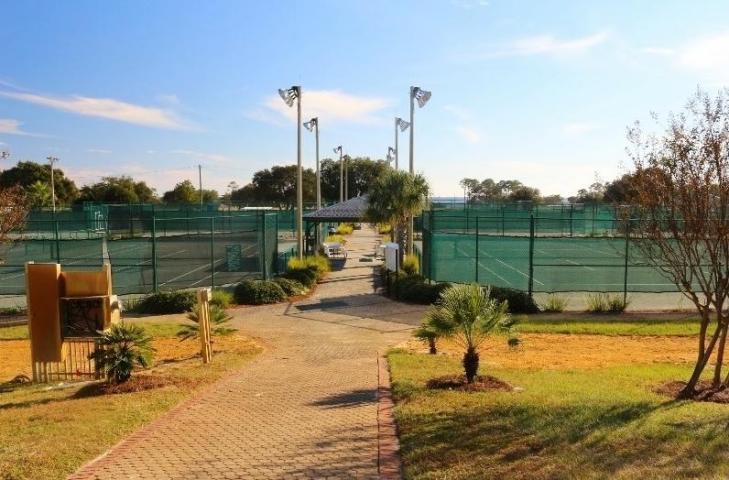 2363 Knotty Pine Drive Navarre, FL 32566 - Photo 20 of 33 a view of a lake with a house in the background