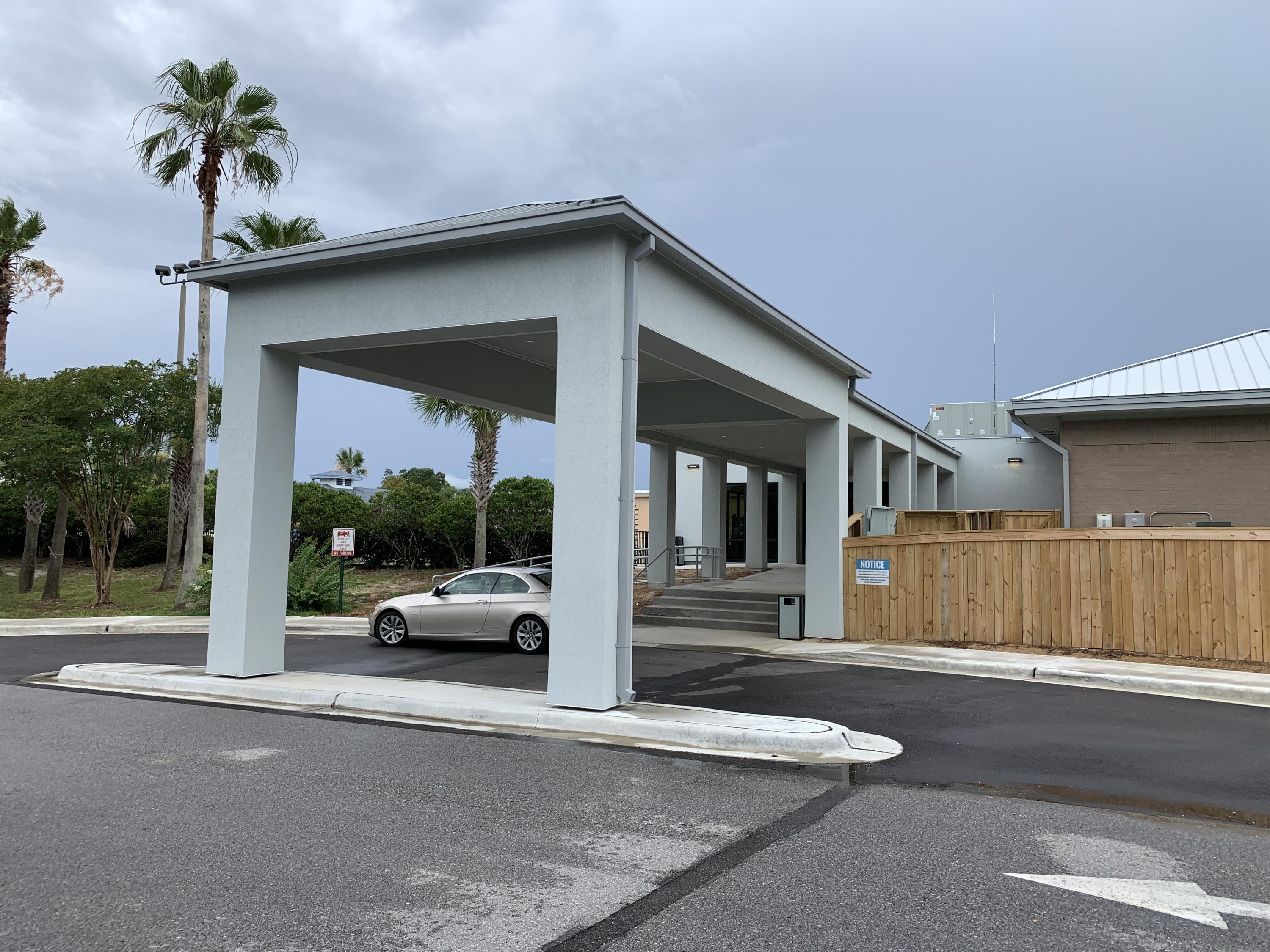 2363 Knotty Pine Drive Navarre, FL 32566 - Photo 27 of 33 a view of a car parked in front of a building