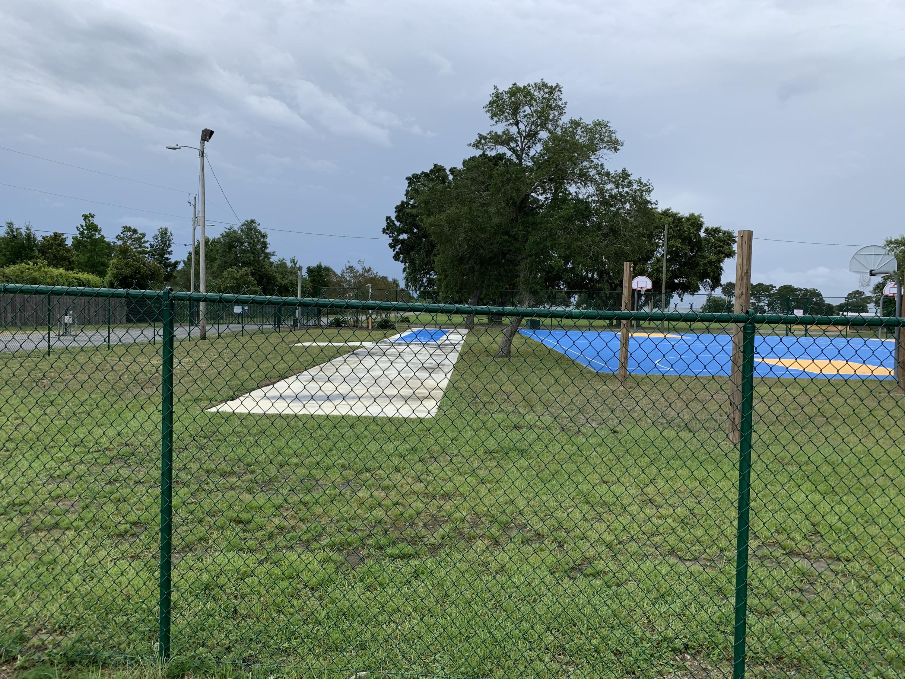 2363 Knotty Pine Drive Navarre, FL 32566 - Photo 30 of 33 a view of a lake with a large park