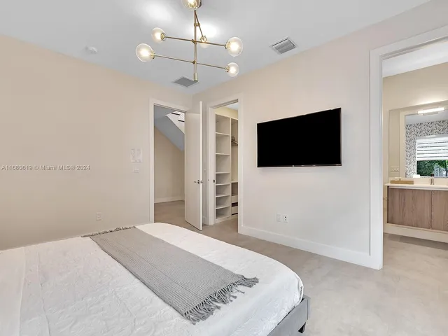 a kitchen with cabinets a sink and appliances