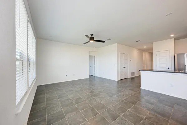 a kitchen with refrigerator and cabinets