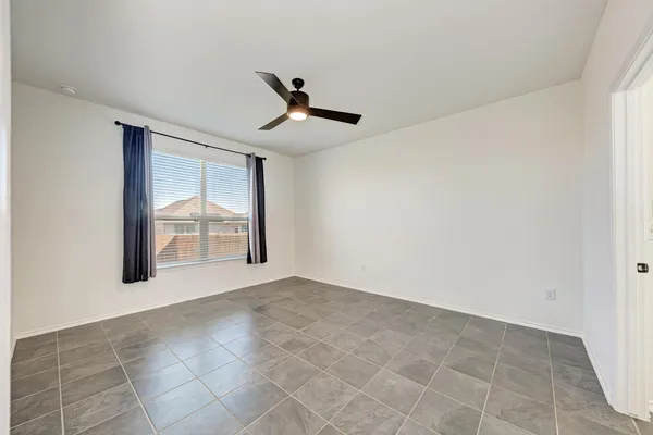 a view of an empty room and a window