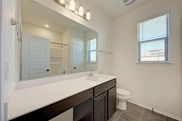 a view of a balcony with floor to ceiling windows