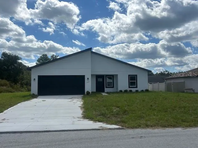 a house view with a garden space